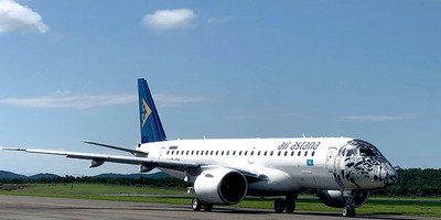 Air Astana's Embraer E190-E2 aircraft on the runway.