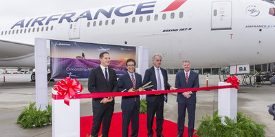 Air France’s Boeing 787 Dreamliner aircraft on the runway acting as the backdrop to a ribbon cutting ceremony.