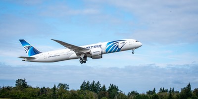EGYPTAIR's new Boeing 787-9 aircraft flying over a runway.
