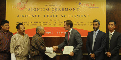 AerCap and Bhutan Airlines executives shaking hands.