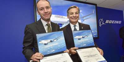 AerCap executives posing for a photo op while holding certificates of purchase.