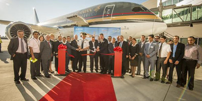 Ribbon cutting ceremony for Royal Jordanian with a Boeing 787 Dreamliner in the background.
