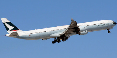 Cathay Pacific's Airbus A340-600 aircraft flying through the sky.